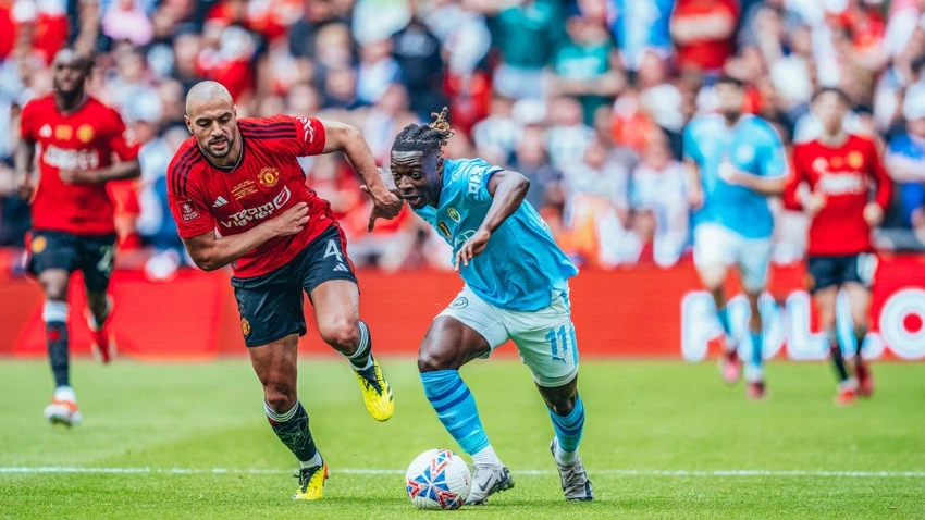 Sofyan Amrabat and Jeremy Doku